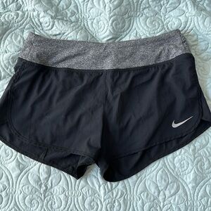 Nike black & grey running shorts with built-in liner, drawstring and pocket.